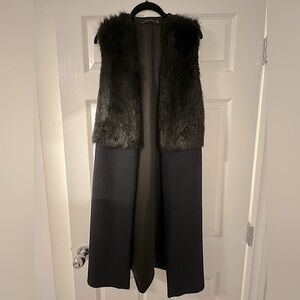 Top front is black faux fur and the rest of the vest is navy blue